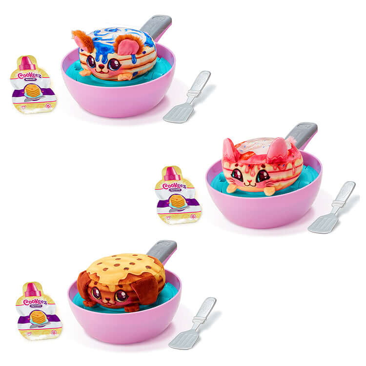 Cookeez Makery Pancake Treatz Playset with three interactive plush pancake toys in pink bowls and spatulas.