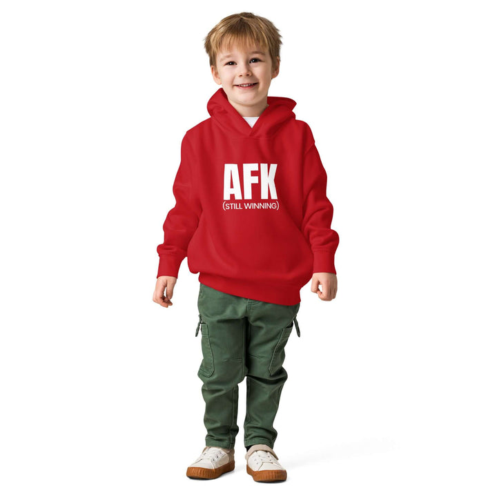AFK Toddler fleece pullover hoodie worn by a smiling child in a red hoodie with green pants.