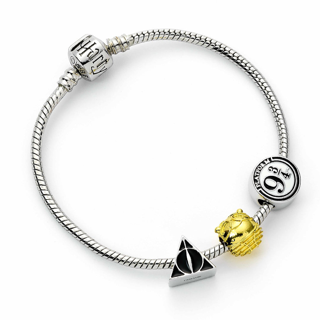 Harry Potter charm bracelet featuring Deathly Hallows, Golden Snitch, and Platform 9 3/4 charms.