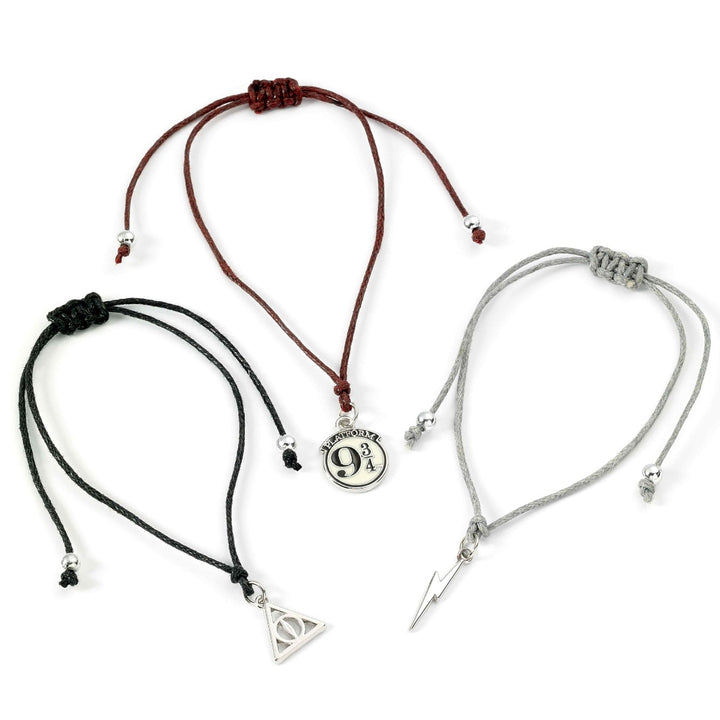 Harry Potter friendship bracelet set featuring Platform 9 3/4, Lightning Bolt, and Deathly Hallows charms on nylon cords.