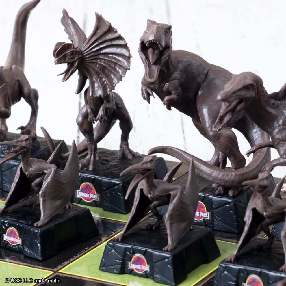Jurassic Park Chess Set featuring detailed dinosaur pieces including Tyrannosaurus Rex and Pteranodons.