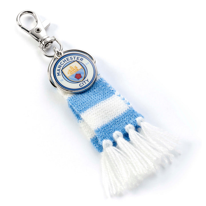 Manchester City backpack hanger featuring blue and white scarf design with logo charm.