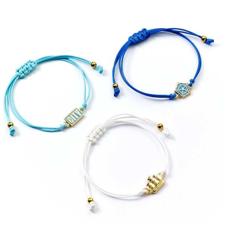 Manchester City friendship bracelet set featuring adjustable cord bracelets in blue and white with team emblems.