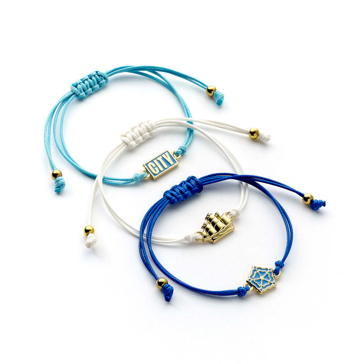 Manchester City friendship bracelet set featuring three adjustable cord bracelets with team emblems.