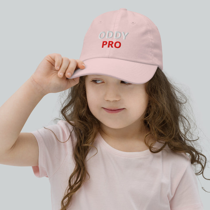 Oddy Pro Youth baseball cap worn by a girl with curly hair, showcasing its stylish design and comfort.