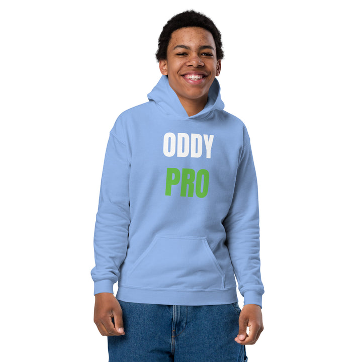 Boy wearing Oddy Pro Youth heavy blend hoodie in light blue with front pocket and smiling.