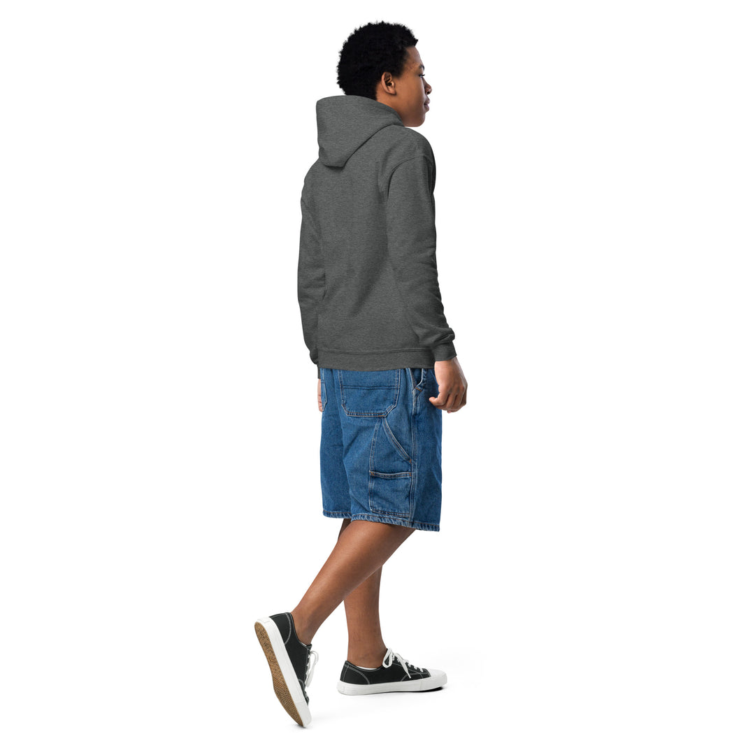 Young person wearing an Oddy Pro Youth heavy blend hoodie with a front pouch pocket and denim shorts.