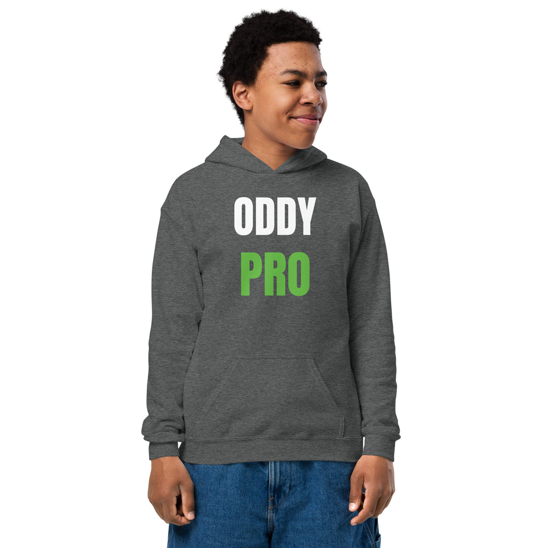 Oddy Pro Youth heavy blend hoodie worn by a smiling child, showcasing its comfortable design and front pouch pocket.