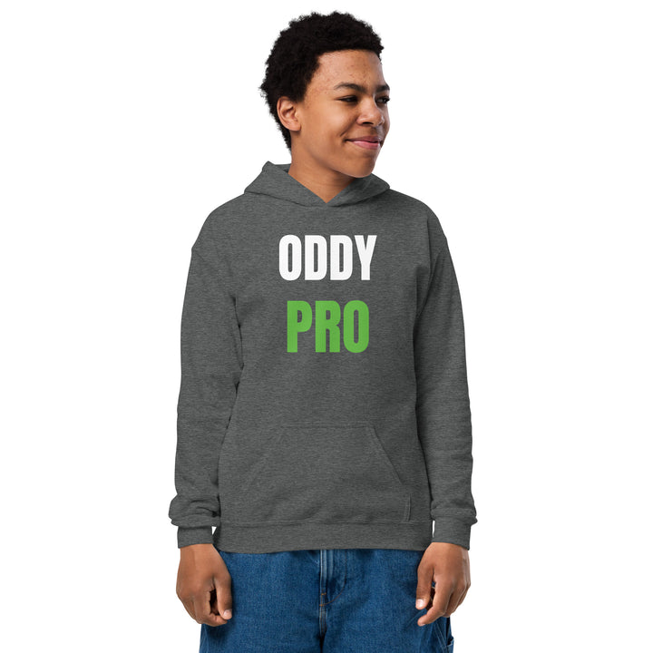 Oddy Pro Youth heavy blend hoodie worn by a smiling child, showcasing its comfortable design and front pouch pocket.