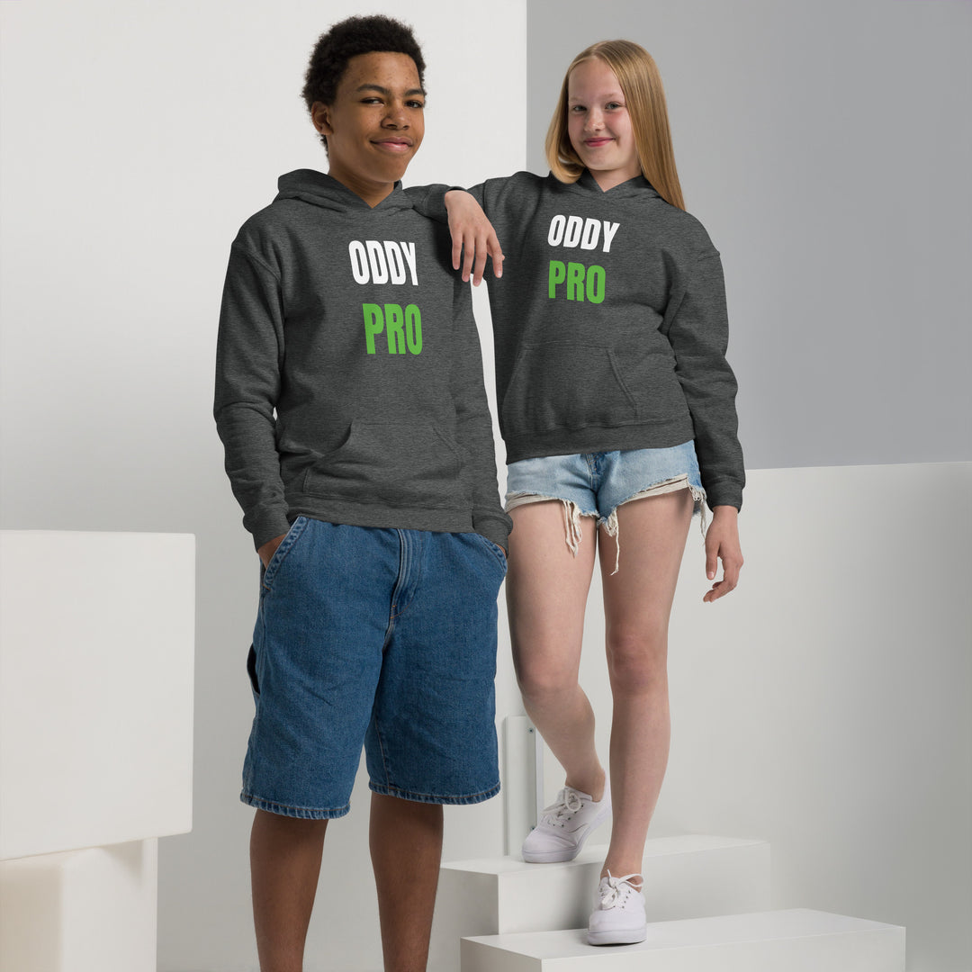 Two children wearing Oddy Pro Youth heavy blend hoodie, showcasing comfort and style in a modern setting.